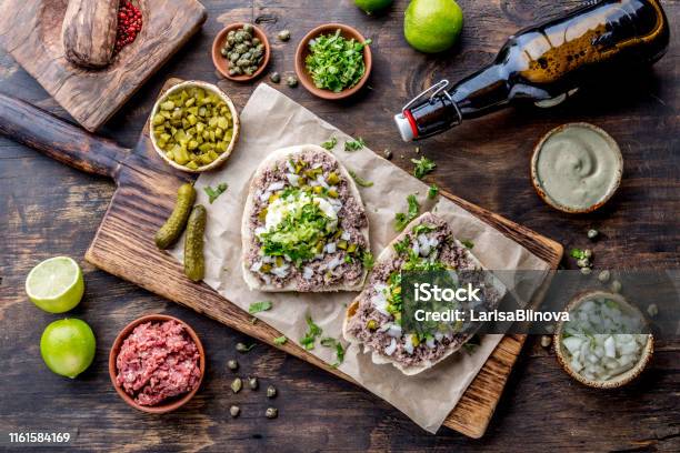 Raw Meat Sandwiches Crudo Valdiviano Tipical Chilean Food From Region Valdivia Chilean Food Aleman Food Tartar Sandwiches Stock Photo - Download Image Now