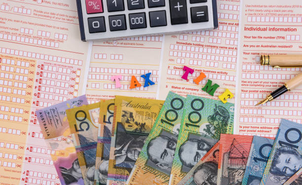 istock Australian dollars with calculator on tax declaration 1161585173