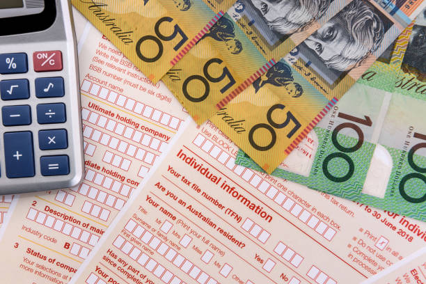 istock Australian tax declaration as background for calculator and dollars 1161585487