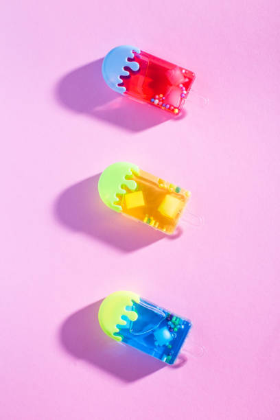 Colorful Ice cream on pastel pink background. Minimal summer concept. Top view