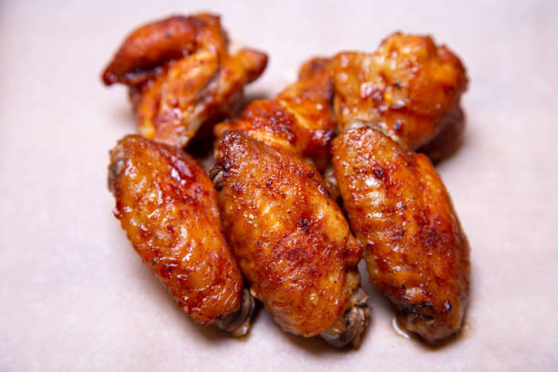 istock Chicken barbecue wings on paper. 1161588071
