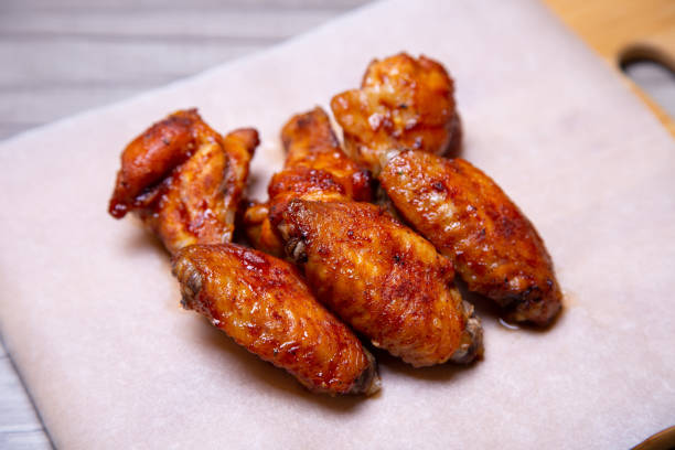 istock Chicken barbecue wings on paper. 1161588077