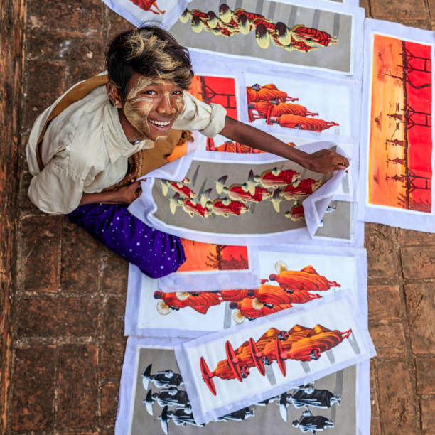 istock Young Burmese boy selling sand paintings in Bagan, Myanmar 1161592379