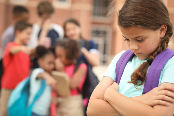 istock Elementary age girl being bullied at school. 1161598483