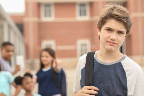 istock Junior high age boy being bullied at school. 1161598578