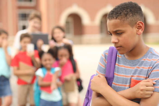 istock Junior high age boy being bullied at school. 1161598633