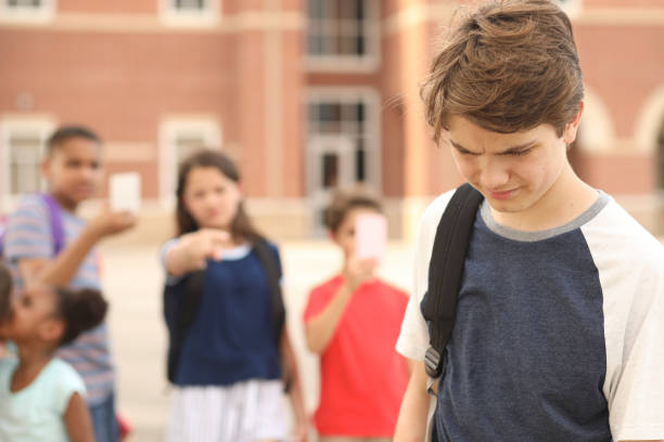 istock Junior high age boy being bullied at school. 1161598700
