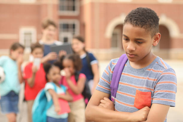 istock Junior high age boy being bullied at school. 1161598711