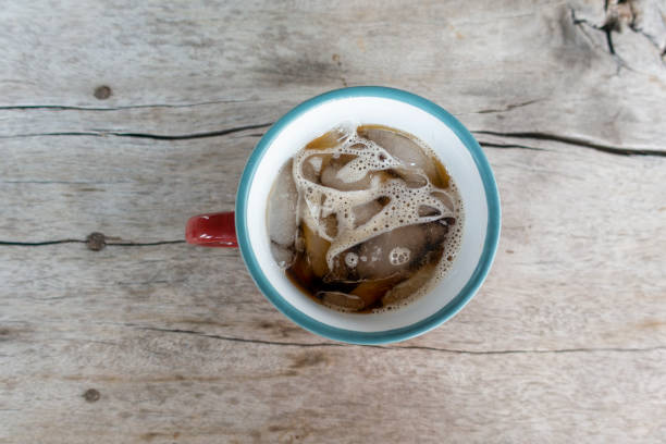 istock Beautiful ice coffee on wood table 1161598997