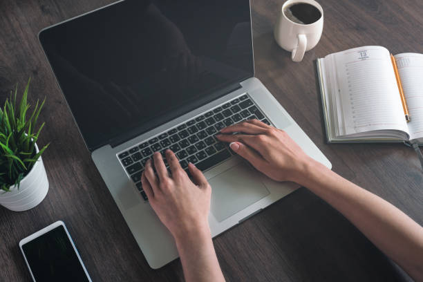 istock Getting down to work. Woman working on a laptop. 1161601331