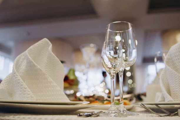istock Wine glasses and glasses on the server table.Luxurious elegant dinner at the table in the restaurant. Holiday table decoration 1161601490