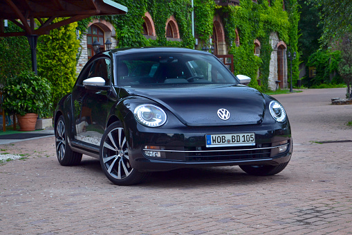 Berlin, Germany - 4th July, 2012: Volkswagen Beetle stopped on the street. The newest Beetle (2011-2019) was produced in Puebla (Mexico).
