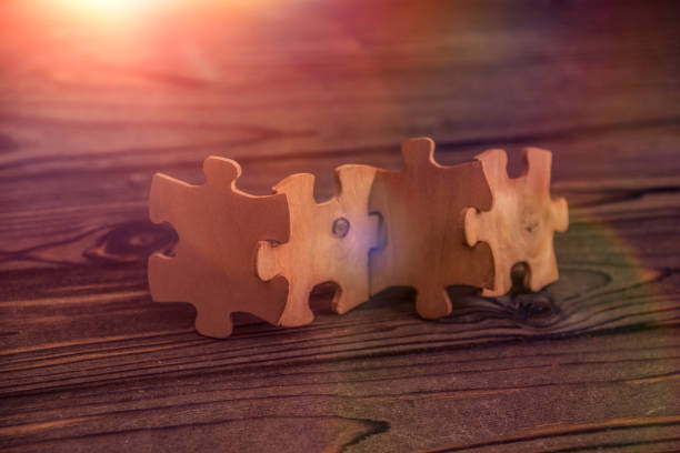 istock wooden puzzle on a wooden background. 1161604210