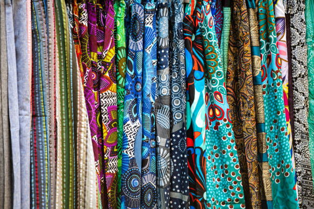 istock Multicolored fabrics in street market 1161605137