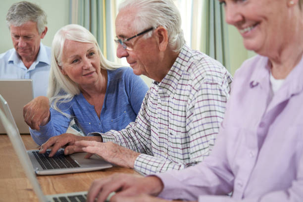istock Teacher With Senior Students In Computing Adult Education Class 1161607687