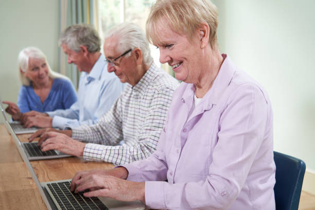 istock Teacher With Senior Students In Computing Adult Education Class 1161607689