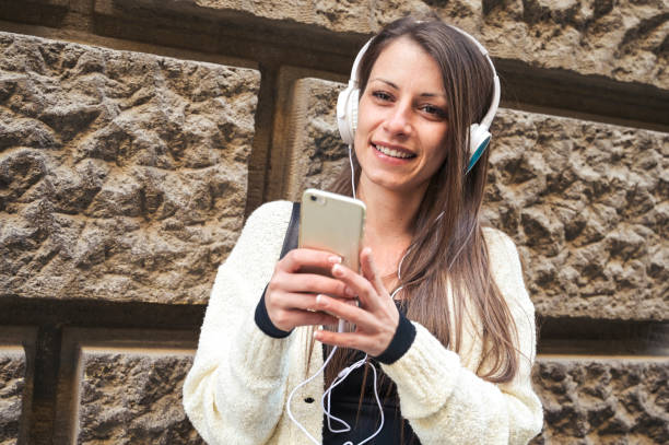 istock Woman with mobile phone outside 1161609129