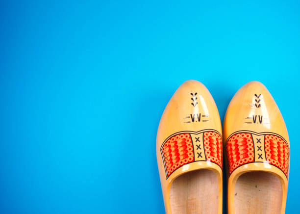 istock Holland, Netherlands, Amsterdam, Volendam, Marken, clogs at blue background with copy space for your own text 1161609154