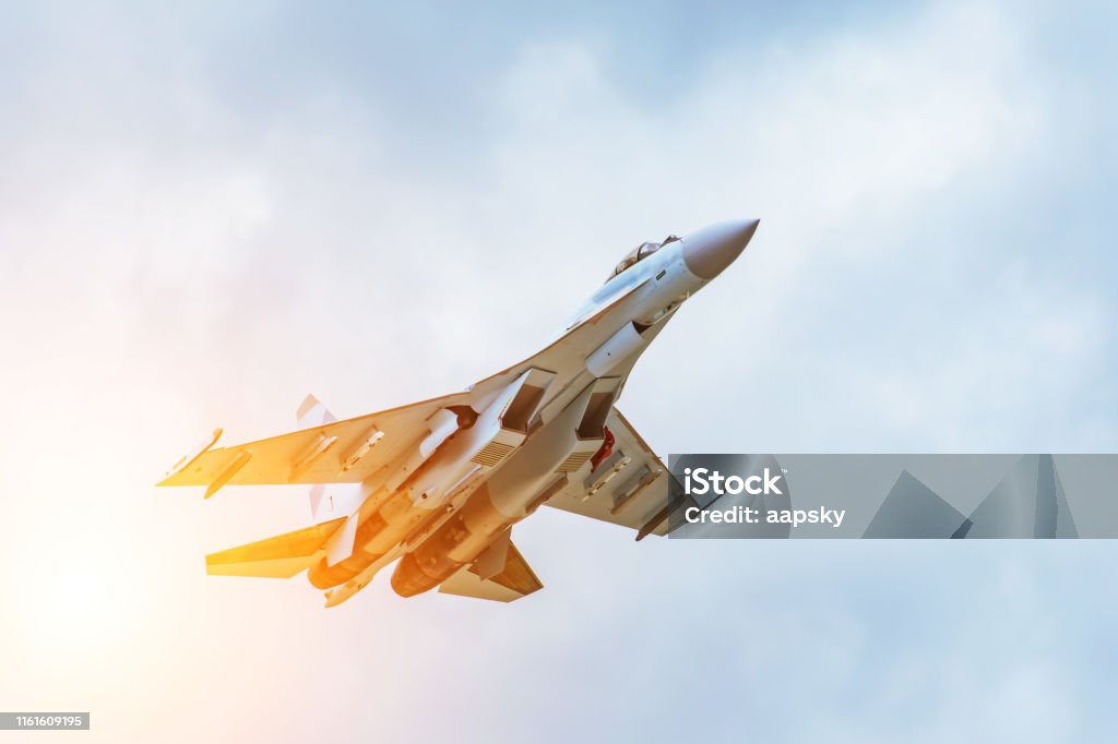 Rapidly taking off combat fighter in the air. Rapidly taking off combat fighter in the air Airplane Stock Photo