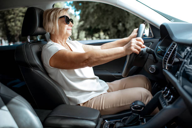 istock Senior woman driving a car 1161609342