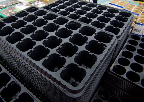 Empty plastic trays for growing young seedlings