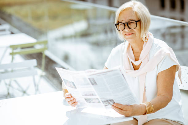 istock Senior woman on the cafe terrace 1161609677