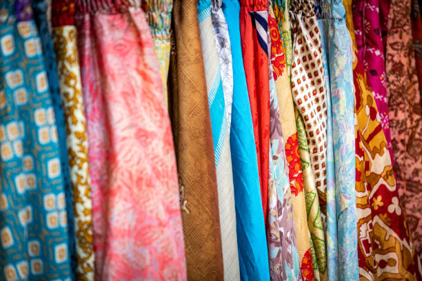 istock Multicolored fabrics in street market 1161610421