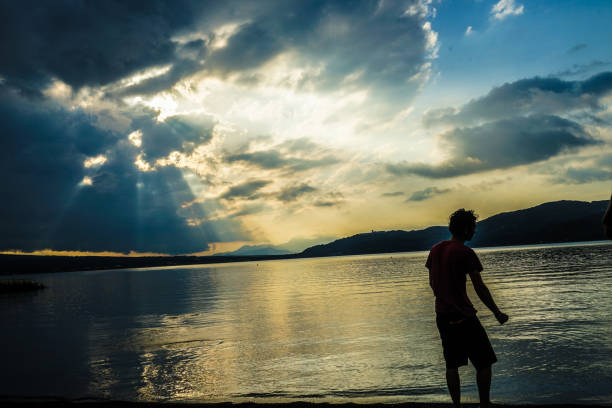 Lake Yamanaka and men silhouette. Shooting Location: Yamanashi Prefecture Yamanaka Village