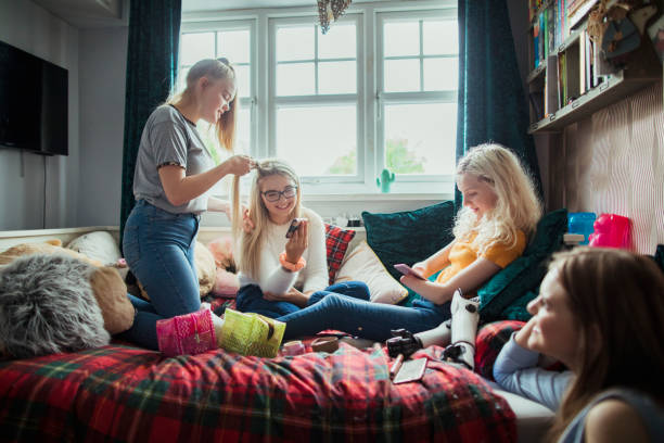 istock Friends Socialising Using Their Phones 1161612523