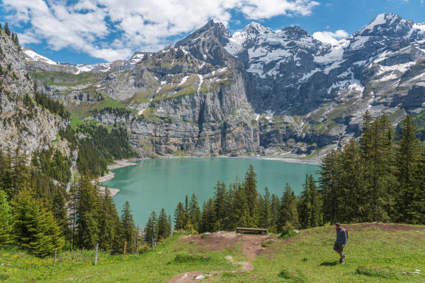 Landscape with Oeschinensee lake close to Kandersteg Landscape with Oeschinensee lake and Bluemlisalp mountain close to Kandersteg in the Bernese Oberland of Switzerland lake oeschinensee stock pictures, royalty-free photos & images
