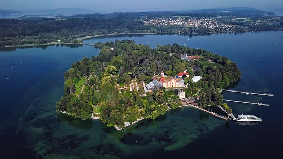 Aerial panorama of Mainau Island on calm morning at Lake Constance (Bodensee), Germany