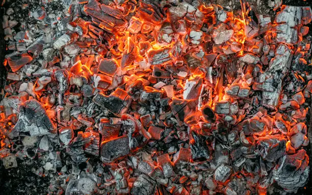Burning coals texture of bonfire abstract background.