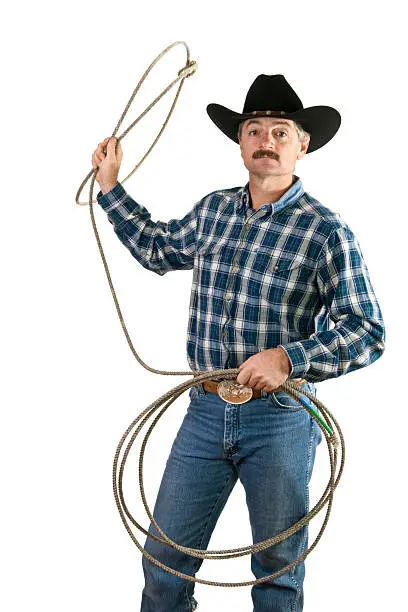 A cowboy swings a lasso.