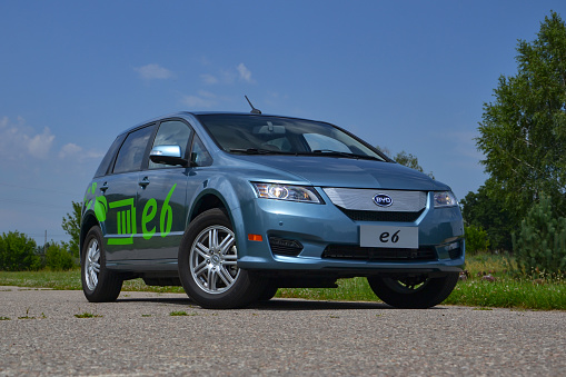 Legionowo, Poland - July 11th, 2012: BYD e6 electric car stopped on the road. Established in 1995, BYD (Build Your Dreams) company specializes in IT, automobile and new energy. Chinese BYD is the one of the largest supplier of rechargeable batteries in the globe.