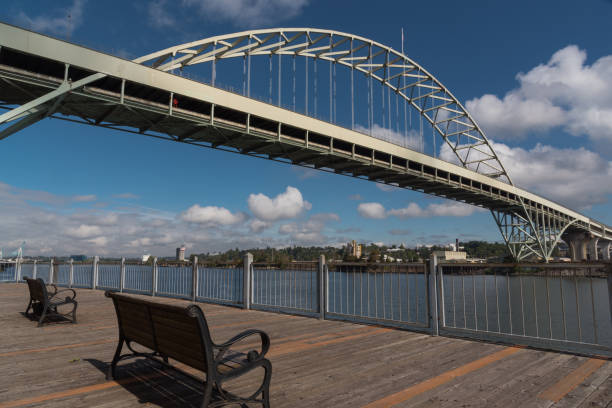 bench on waterfront pier with fremont bridge views, portland oregon - portland oregon oregon waterfront city imagens e fotografias de stock