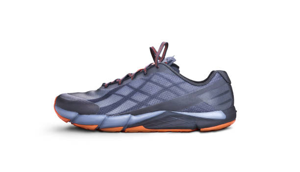 istock Front view of gray and orange trainers. 1161646357