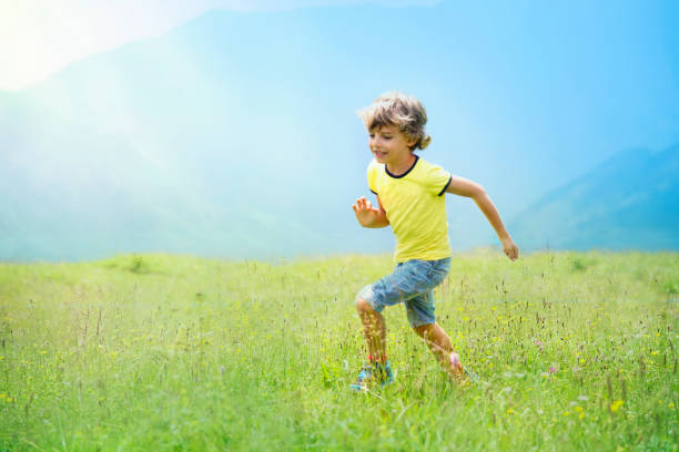 istock Cute Boy Running Outdoor 1161646580