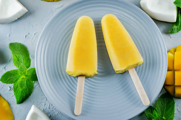 istock Mango coconut ice cream with fruits and mint leaves 1161650156