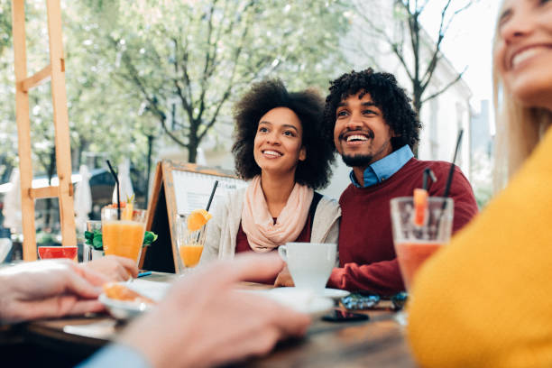 istock Afro-american couple with friends 1161653241