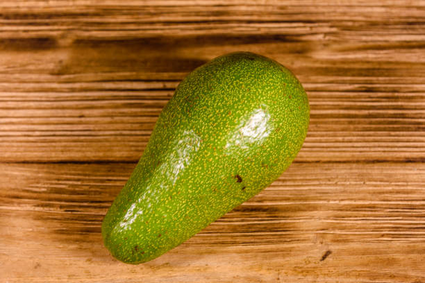 istock Ripe avocado fruit on a wooden table 1161658576