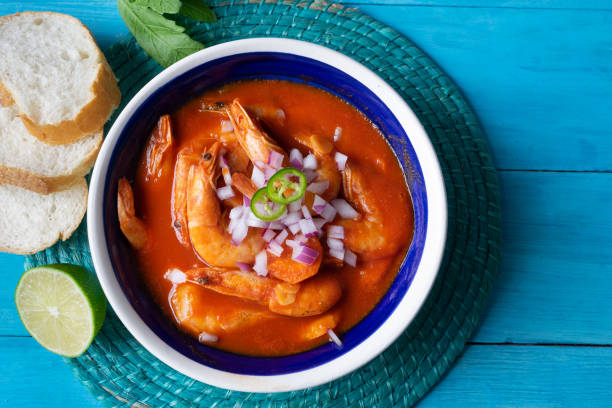 istock Mexican shrimp soup on blue background 1161661446