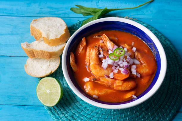 istock Mexican shrimp soup on blue background 1161662362