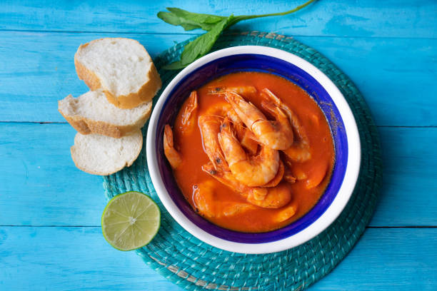 istock Mexican shrimp soup on blue background 1161662693