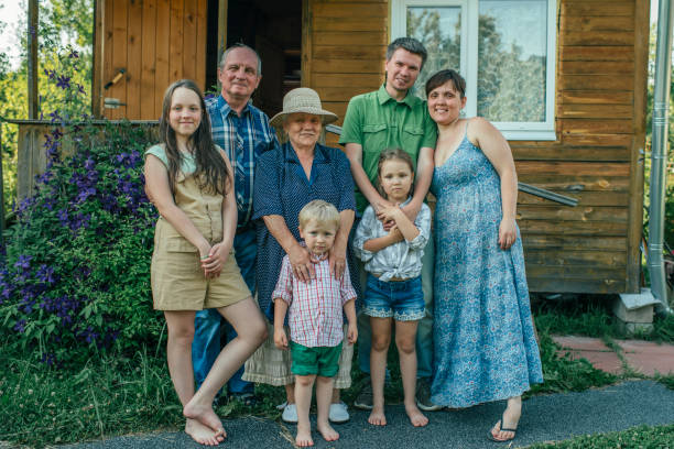 istock Three generation family near their house in summer 1161663041