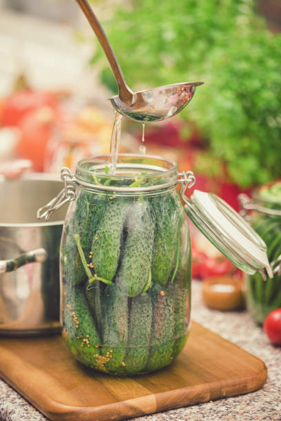 istock Preserving Fresh Organic Cucumbers in the Jars 1161663602