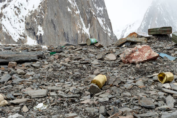 istock Garbage scattered over snowy mountain. Let's save the planet and recycle the excess garbage. 1161667368