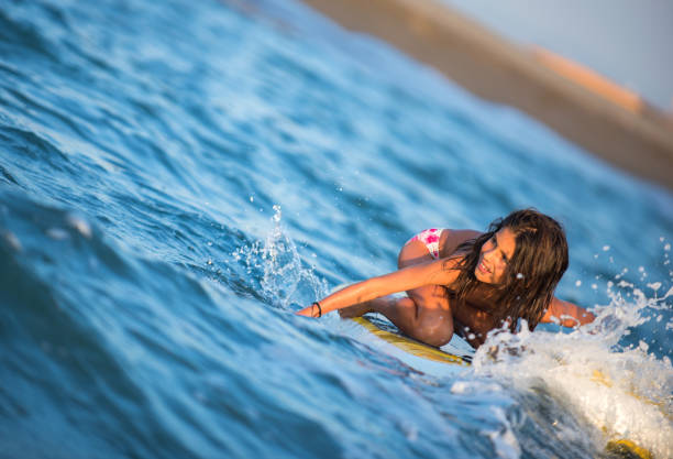 istock Young surfer rides on surfboard with fun on sea waves 1161667420