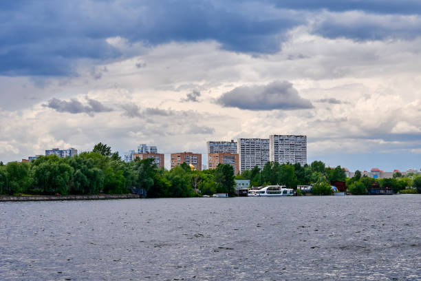 istock Water and beautiful clouds sky over the tall buildings. 1161668239