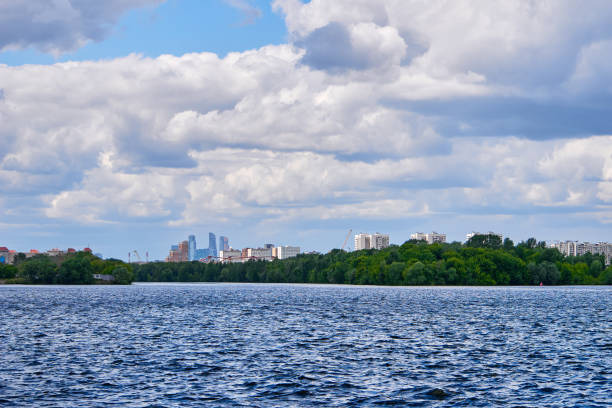 istock Water and beautiful clouds sky over the tall buildings. 1161668263