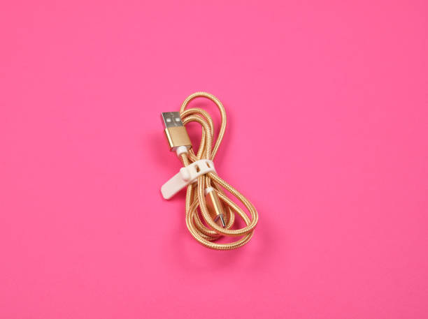 istock twisted golden cable for charging with electricity equipment 1161668350